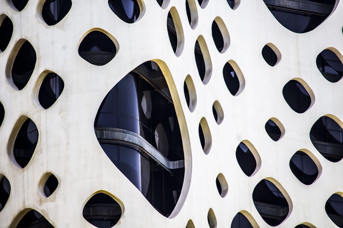 Close-up of a modern building facade with oval patterns.